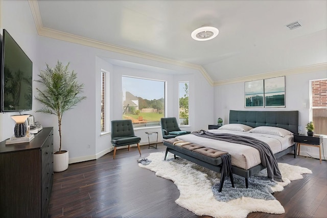 bedroom with dark hardwood / wood-style flooring and ornamental molding