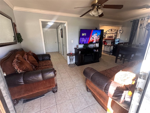 living room with light tile patterned floors, ceiling fan, and crown molding