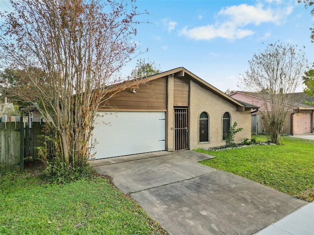 ranch-style home featuring a garage and a front yard