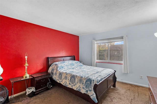 carpeted bedroom with a textured ceiling