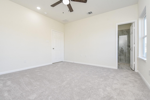 unfurnished room with light carpet and ceiling fan