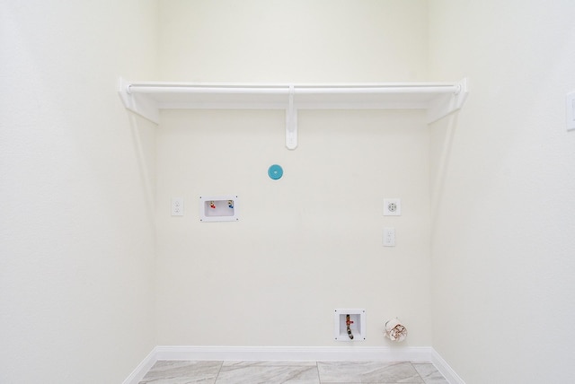 washroom featuring hookup for an electric dryer, hookup for a gas dryer, light tile patterned floors, and washer hookup