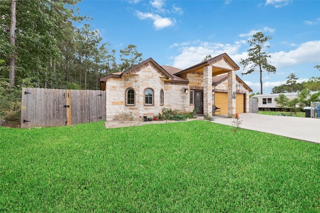 view of front of home featuring a garage and a front lawn