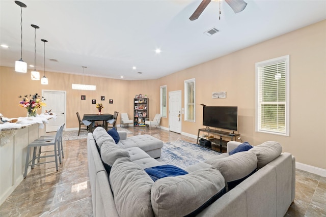 living room with ceiling fan