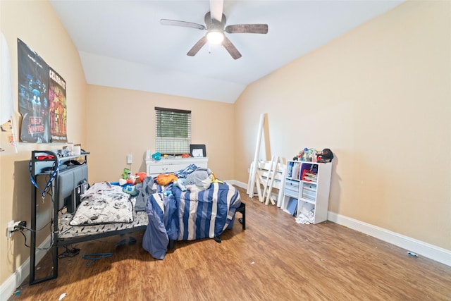 bedroom with wood-type flooring, vaulted ceiling, and ceiling fan