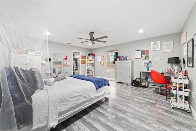 bedroom featuring ceiling fan and wood-type flooring