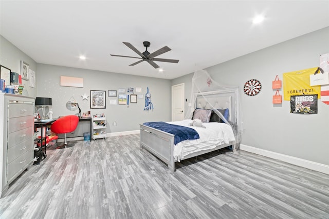 bedroom featuring ceiling fan and light hardwood / wood-style floors