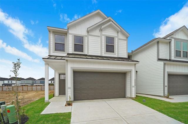 view of front facade with a garage and a front yard