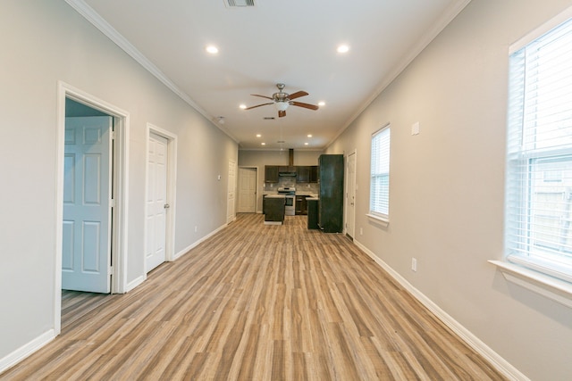 unfurnished living room featuring light hardwood / wood-style floors, ceiling fan, and crown molding