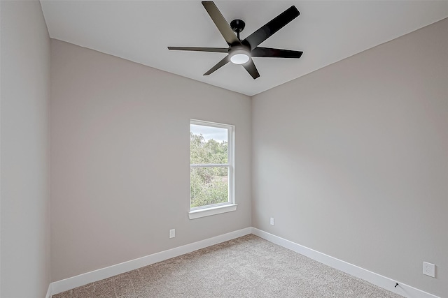 empty room with ceiling fan and light colored carpet