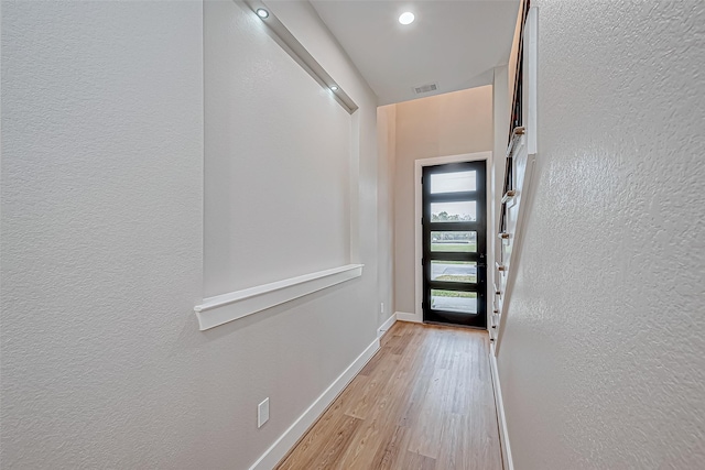 doorway to outside with light hardwood / wood-style flooring