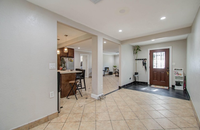 view of tiled foyer entrance