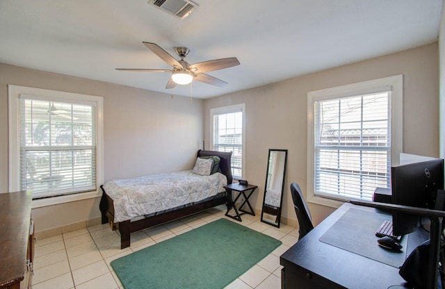 bedroom featuring ceiling fan and light tile patterned flooring