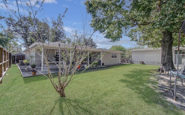 back of property featuring a patio area, central air condition unit, and a yard