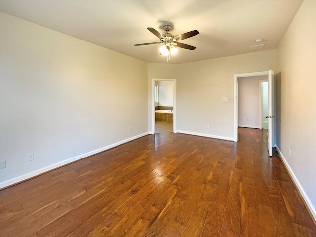 unfurnished room featuring ceiling fan and dark hardwood / wood-style flooring