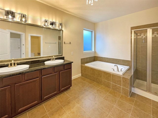 bathroom with vanity, tile patterned floors, and independent shower and bath