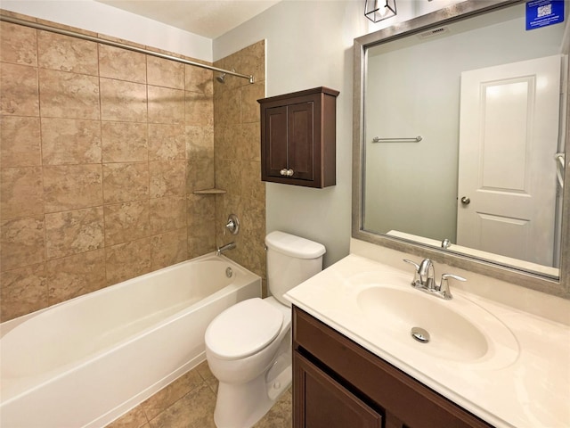 full bathroom featuring toilet, vanity, tiled shower / bath combo, and tile patterned floors