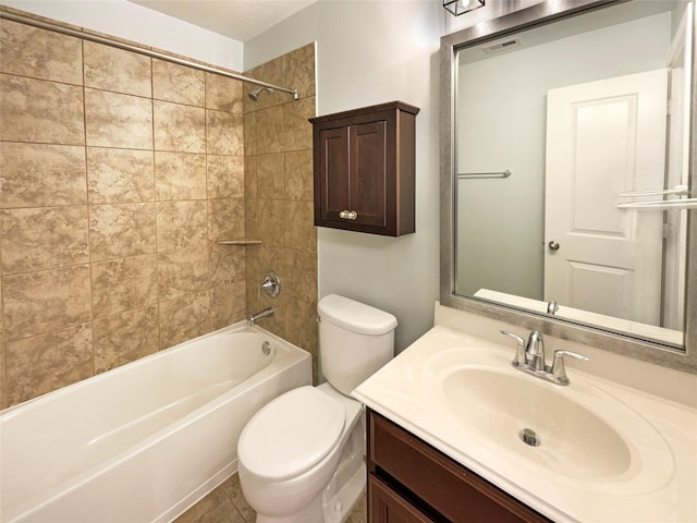 full bathroom featuring vanity, toilet, and tiled shower / bath