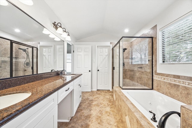 bathroom featuring plus walk in shower, vanity, and lofted ceiling