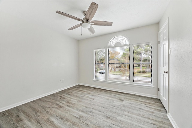 spare room with ceiling fan and light hardwood / wood-style floors