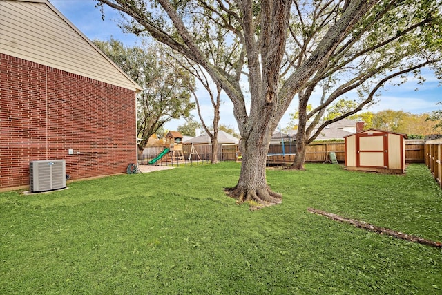 view of yard with a storage unit, a playground, cooling unit, and a trampoline