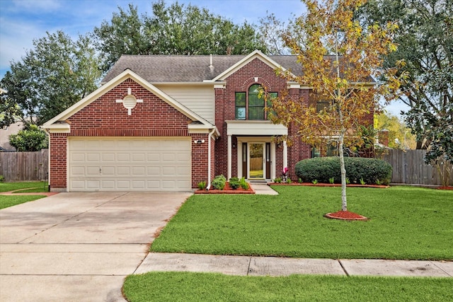 view of property with a garage and a front lawn