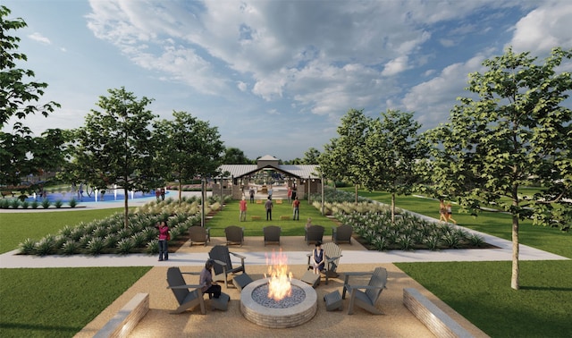 surrounding community featuring a gazebo, an outdoor fire pit, and a lawn