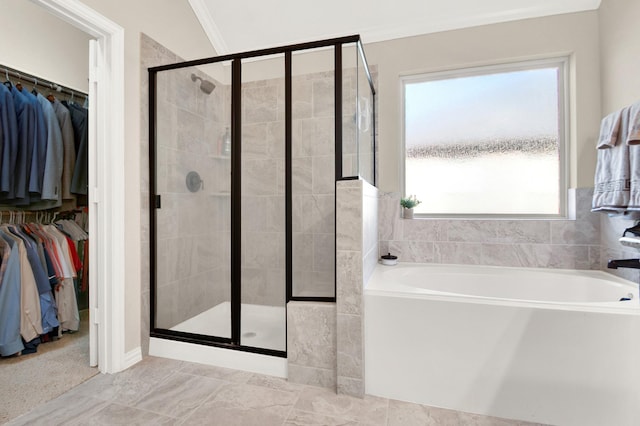 bathroom featuring shower with separate bathtub and crown molding