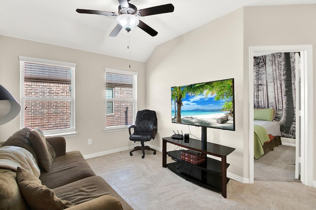 living room with ceiling fan and vaulted ceiling