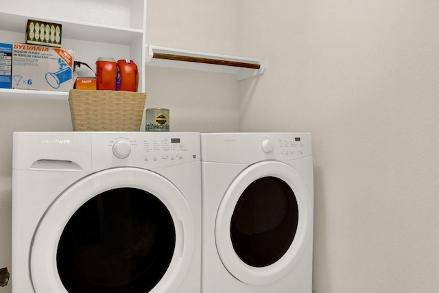 washroom with washer and dryer