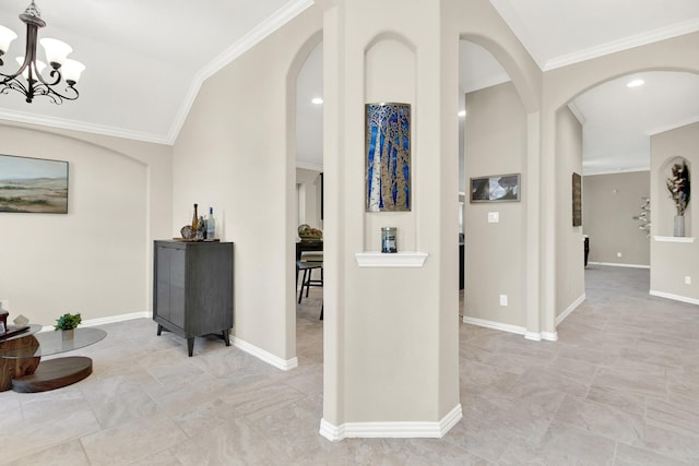 corridor with crown molding and a notable chandelier