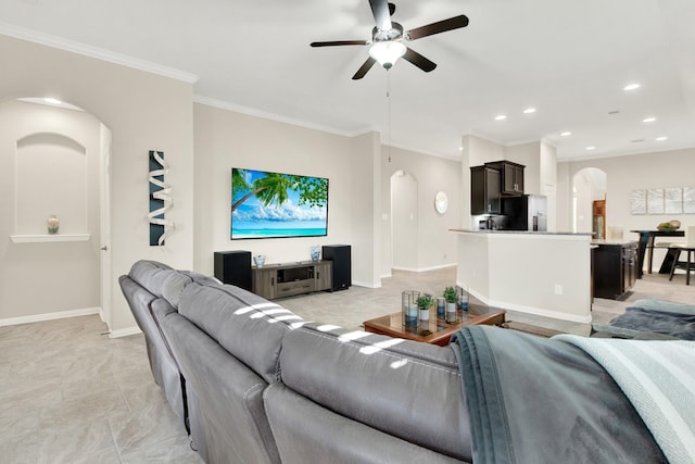 living room with ceiling fan and crown molding