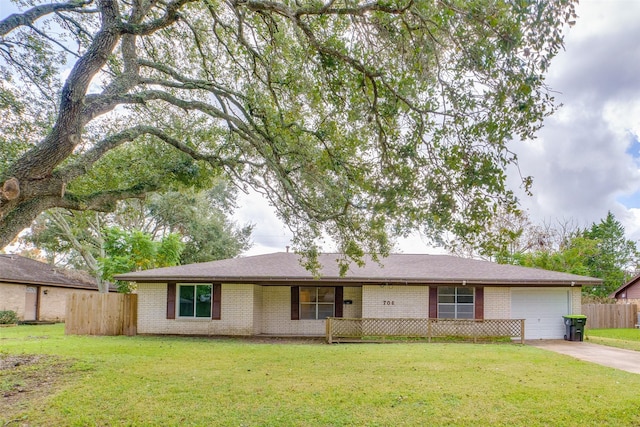 ranch-style house with a front lawn and a garage