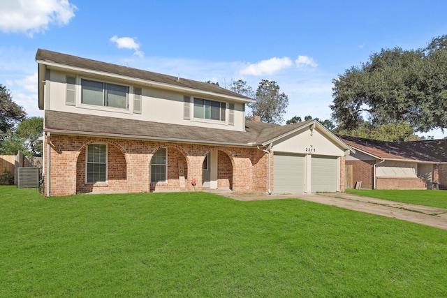 view of front of property featuring cooling unit, a garage, and a front lawn