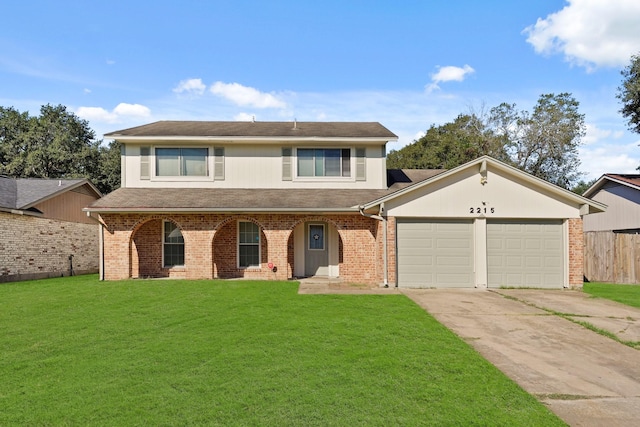 view of property with a front yard and a garage