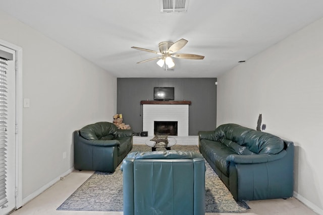 living room with ceiling fan, light colored carpet, and a brick fireplace