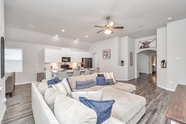 living room with ceiling fan and hardwood / wood-style floors