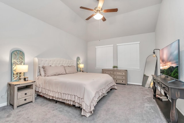 carpeted bedroom featuring ceiling fan and high vaulted ceiling