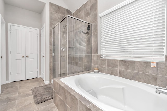 bathroom with tile patterned floors and separate shower and tub