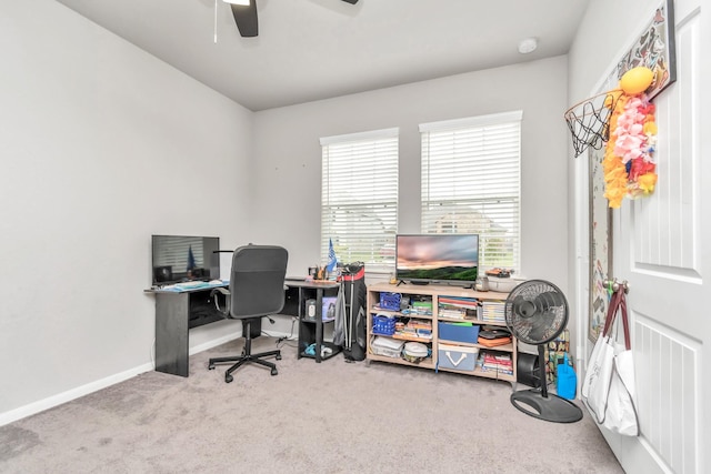 home office with radiator, carpet floors, and ceiling fan