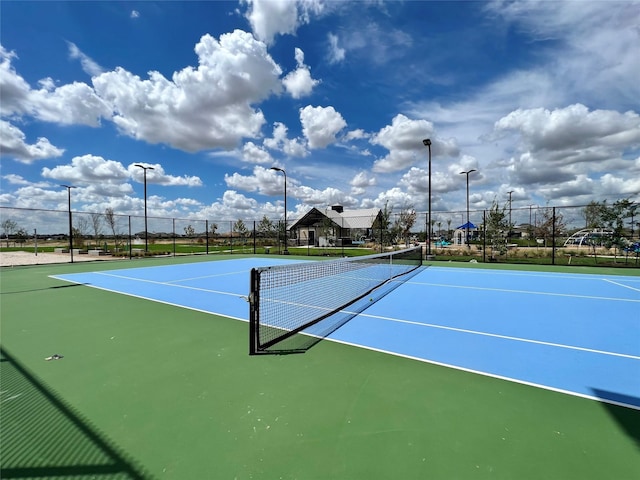 view of sport court featuring basketball hoop