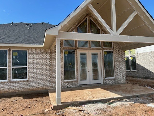 back of house with french doors and a patio