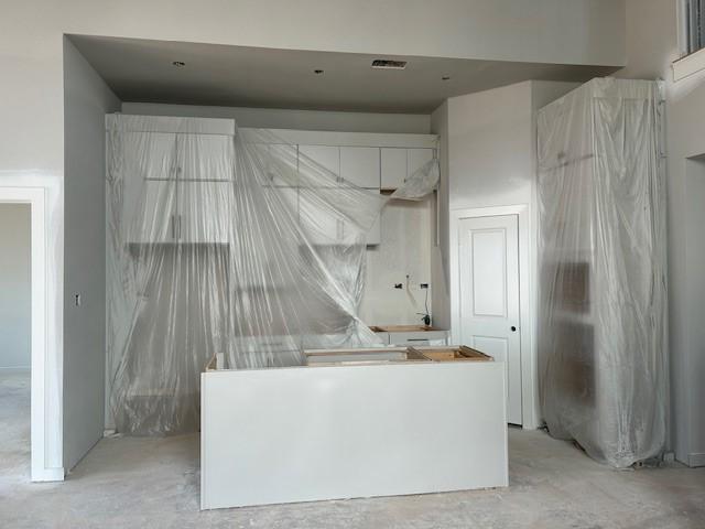 kitchen featuring white cabinets