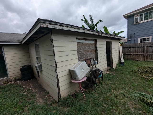 view of outbuilding with a lawn