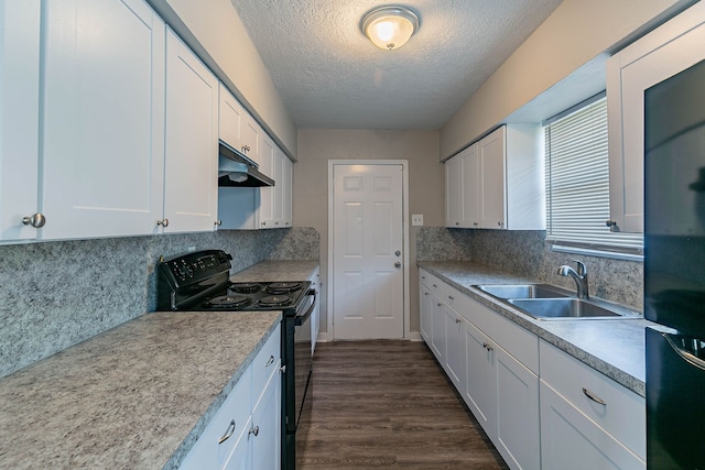 kitchen with black appliances, decorative backsplash, white cabinets, and sink