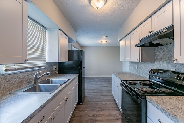 kitchen featuring white cabinets, decorative backsplash, black range with electric stovetop, and sink