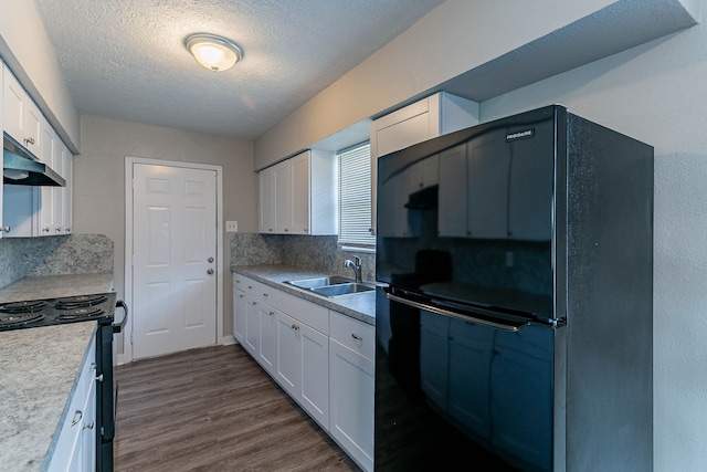 kitchen featuring black appliances, sink, decorative backsplash, a textured ceiling, and white cabinetry