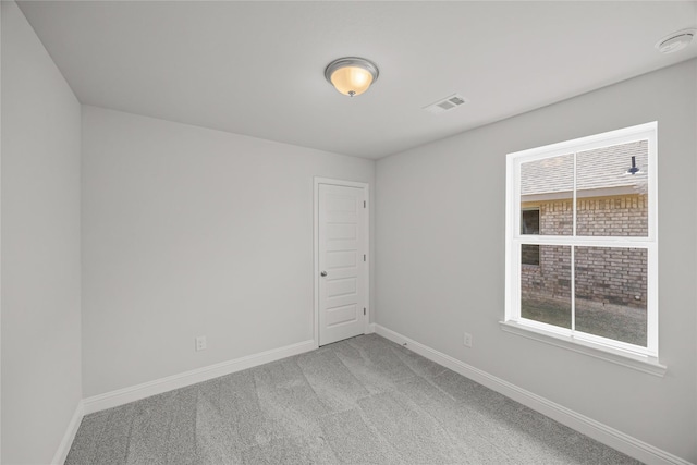 10318 Prairie Dunes Ln, Cleveland, TX 77327 - unfurnished room with baseboards, light carpet, healthy amount of natural light, and a smoke detector