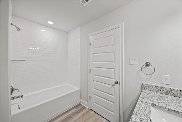 10318 Prairie Dunes Ln, Cleveland, TX 77327 - bathroom featuring wood finished floors, bathtub / shower combination, and vanity