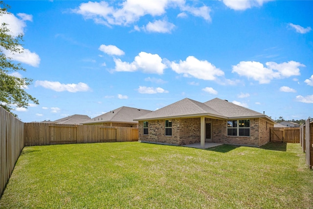 10318 Prairie Dunes Ln, Cleveland, TX 77327 - rear view of property with brick siding, a shingled roof, and a patio area